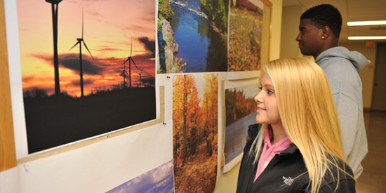 Two GMMD students view and critique student work.