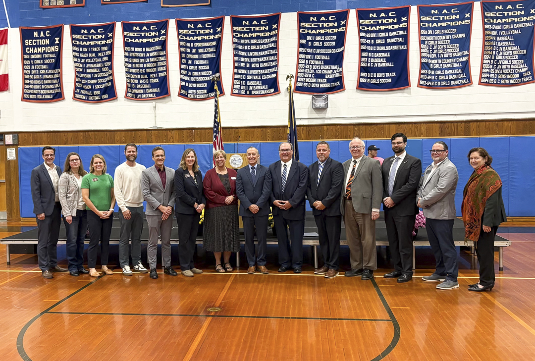 A group of officials and college representatives at The Ogdensburg Promise unveiling event.