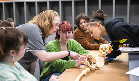 Associate Professor Kelly Ficner works with students on identifying skeletal remains.