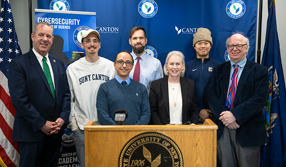 Senator Kirsten Gillibrand stands with Associate Professor Kambiz Ghazinour, Assemblyman Scott Gray and cybersecurity students during a press Cyber Academy press conference.