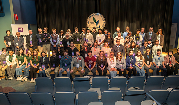 Launch Day participants pose together for a photo in Kingston Theater.