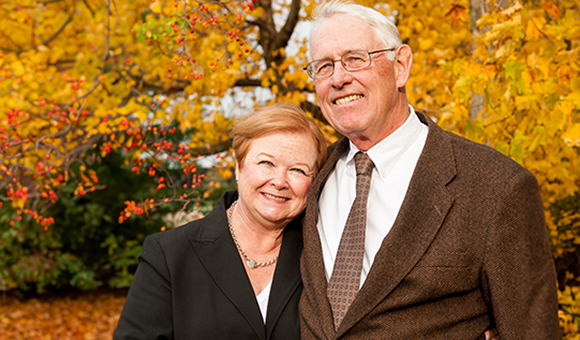 Linda and Danny Fay embrace on a beautiful fall day.