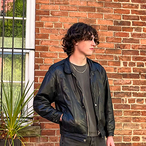 Reed Putman stands in front of a brick building.