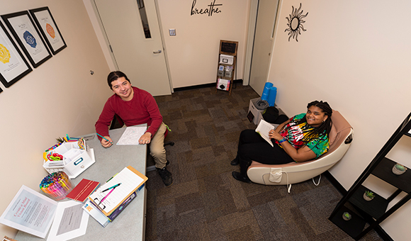 Brayden White and Kyann Jemmott sit in the college’s new Refresh Room.