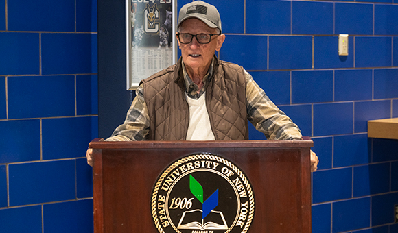 Terry Martin speaks at a podium during the ceremony to honor his legacy.