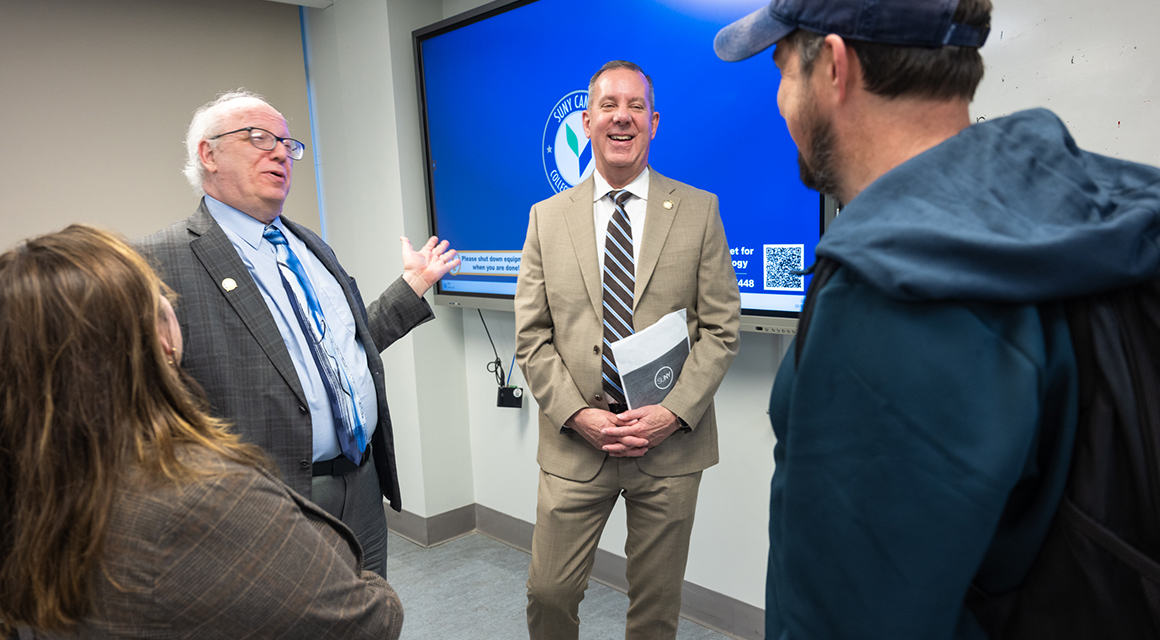 President Szafran, Assemblyman Scott Gray and a student chat after the ACE|ASAP event.