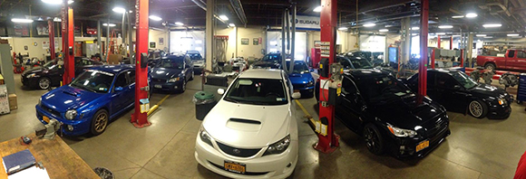 Overhead view of Auto lab with a dozen cars and trucks.