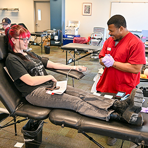 A student gives blood.
