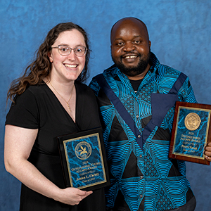 Jessica Christy and Pierre Nzuah holding their Alumni Awards.