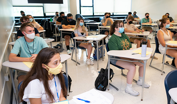 Students sit in a classroom in Wicks on the first day of classes.