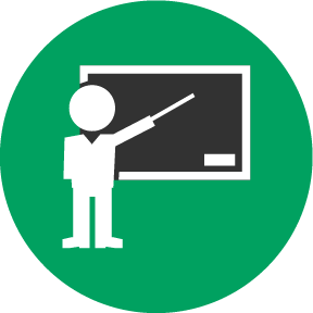 Faculty pointing at chalkboard