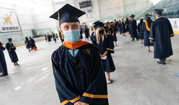 Keegan Fawcett waits in line for the Commencement Ceremony to begin.