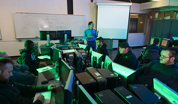 Minhua Wang teaches in the Cyber lab
