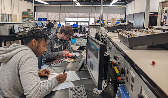 Students work in the Electrical Technology lab.
