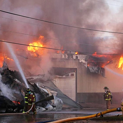 Firefighters battle a large building fire.