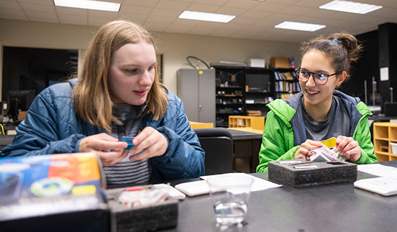 Students assemble an electrical experiment during Engineer's Week.