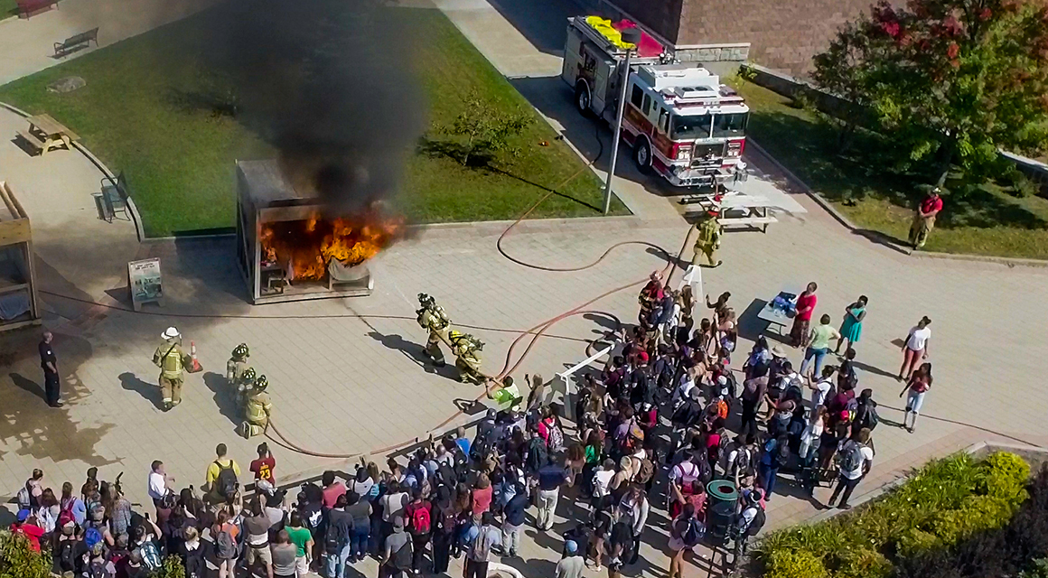 An aerial view of a SUNY Canton fire safety demonstration in Roselle Plaza.