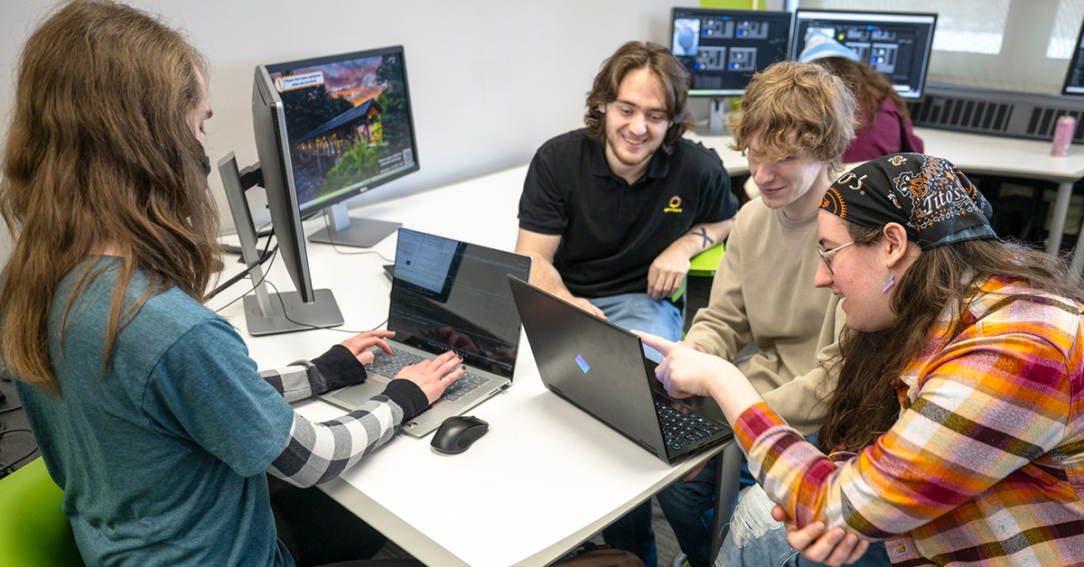 Four Game Design Club members test a game in SUNY Canton's Digital Design Studio.