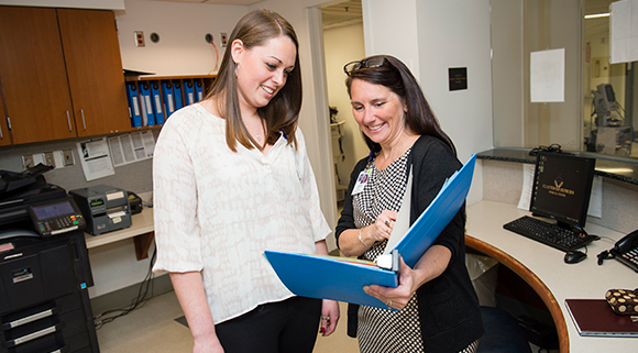 An intern works with Instructor Jennie Flanagan