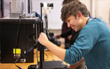 A student works on a 3D printer in Nevaldine.