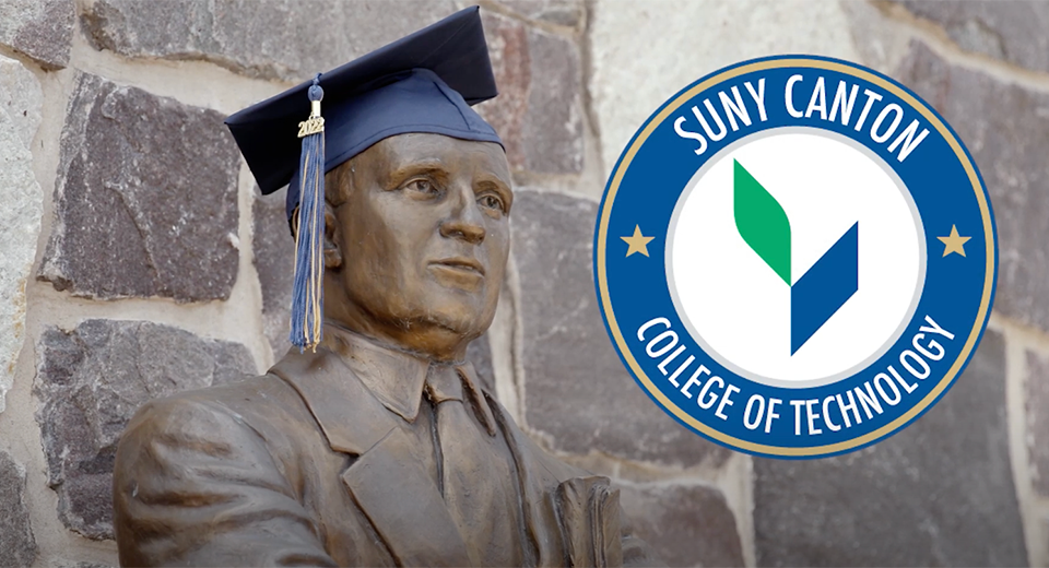 Terry Martin statue wearing graduation cap.
