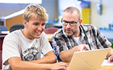 Professor Lucas Craig works with a student in the Mechanical Technology lab.