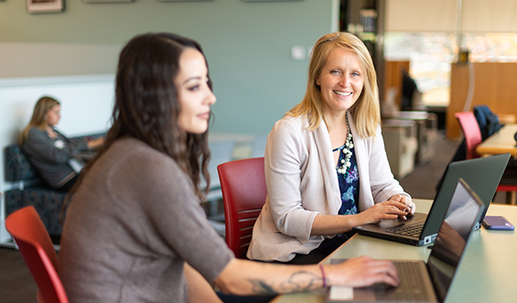 Johanna Lee works with a student in the Learning Commons.