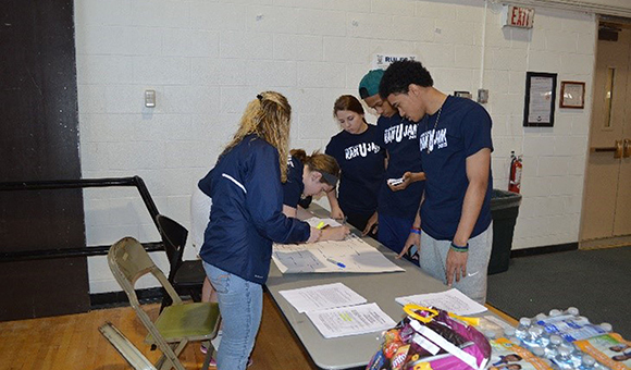Students assist with registration