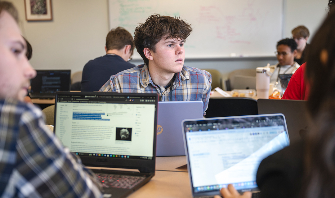 SUNY Canton student Owen Brace works with his team on a Launch Day project. Each team was comprised of students from multiple colleges to encourage networking.