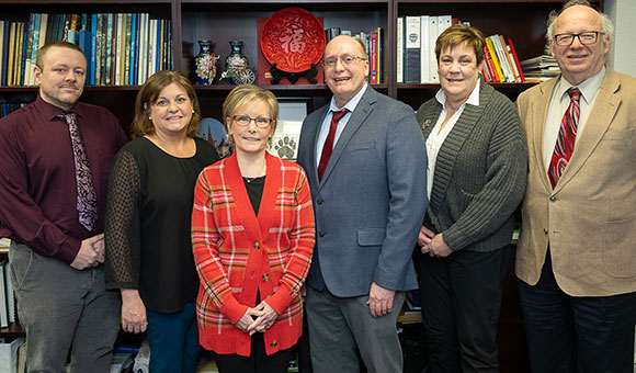 From left to right, Interim Dean Kirk Jones, Lecturer Christina Martin, Distinguished Teaching Professor Maureen Maiocco, Professor Charles Jenner, Provost Peggy De Cooke, and President Zvi Szafran.