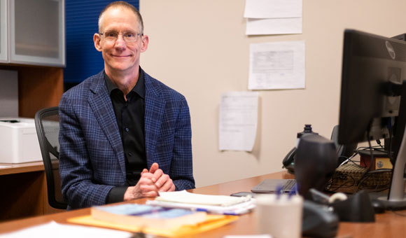 Phil Neisser at his desk