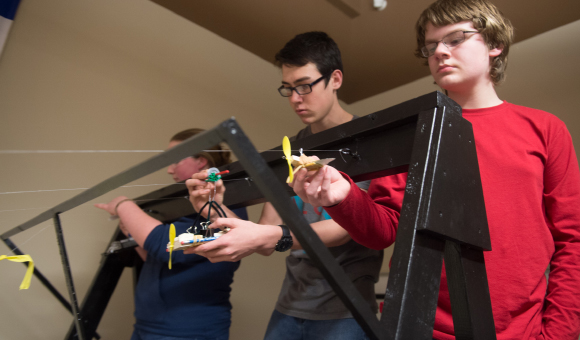 Contestants prepare to launch their hand-built zip line racers in the annual engineering challenge in 2017.