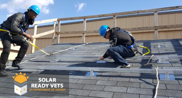 Solar Ready Vets - students install solar panels on a practice roof.