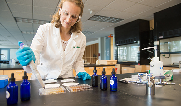 Erica Sharpe prepares an experiment in the chemistry lab