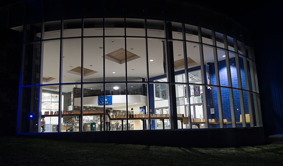 Roos House lobby lit up at night