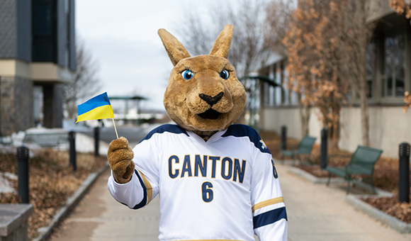 Roody waves a Ukraine flag in the plaza.