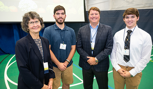 Scholarship recipients Danny Lucey and George Cornell are joined by their sponsors.