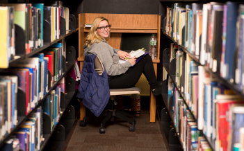 A student studies in the library.
