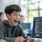 An excited student shows off some computer code.