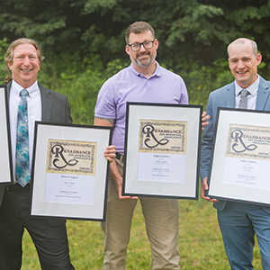 Greg Kie, Matt Mulkin, and Travis Smith hold SUNYCUAD 2026 awards.
