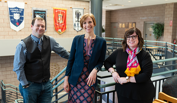 RJ Thayer, Lenore VanderZee and Courtney Bish stand in the Miller Campus Center.
