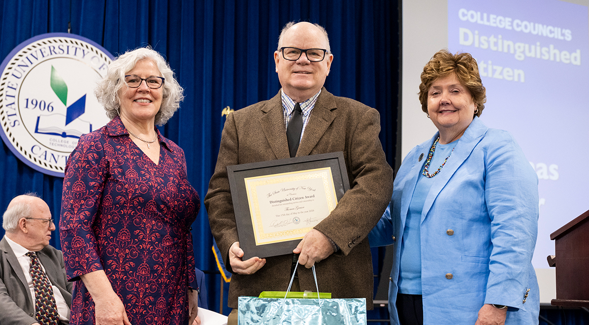 Thomas Graser receives the Distinguished Citizen Award from College Council members Kathy Dodge and Jenn Stevenson.