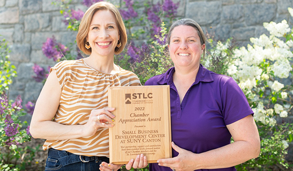 Lenore VanderZee and Jennifer McCluskey hold their St. Lawrence Chamber of Commerce Appreciation Award.