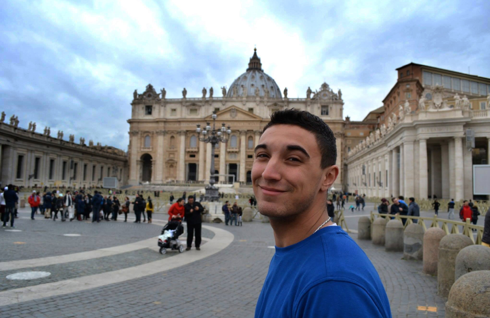 A student in front of St. Peter's Basilica