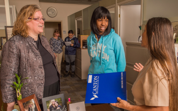 A student speaks with Julie Parkman and Terri Clemmo of Career Services.